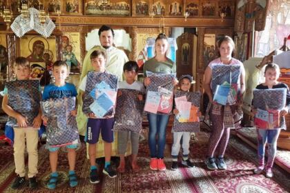 Ghiozdane şi rechizite şcolare pentru 4.000 de copii din Arhiepiscopia Dunării de Jos – fotografia 1